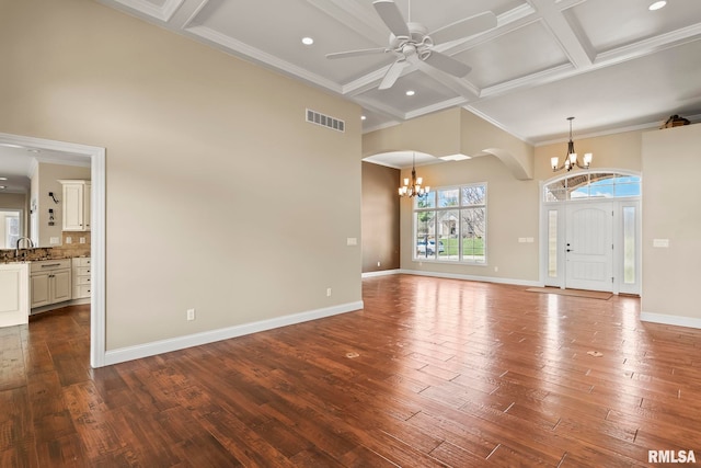 unfurnished living room featuring coffered ceiling, baseboards, visible vents, and dark wood-type flooring