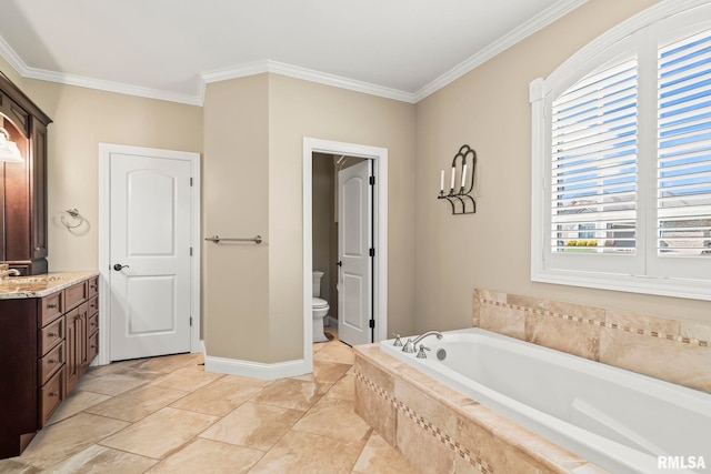 full bathroom featuring vanity, crown molding, toilet, baseboards, and a bath