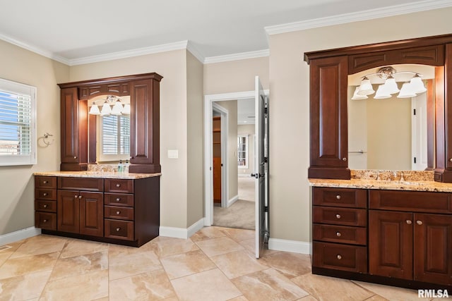 bathroom with plenty of natural light, a sink, and two vanities