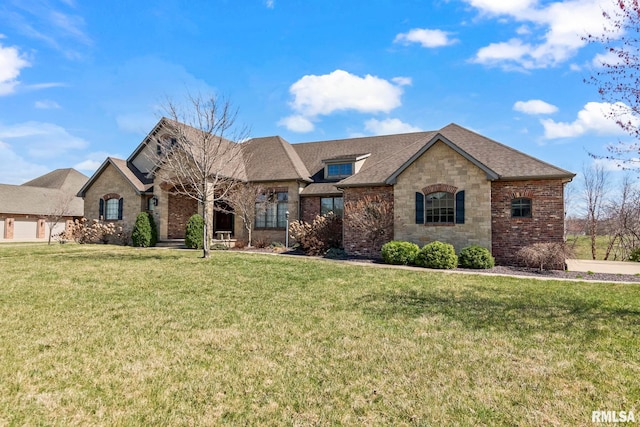 french country inspired facade featuring stone siding, brick siding, a front lawn, and roof with shingles
