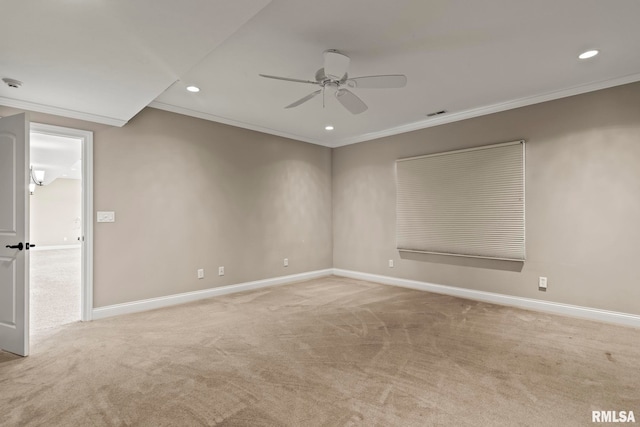 empty room with a ceiling fan, crown molding, baseboards, and light colored carpet