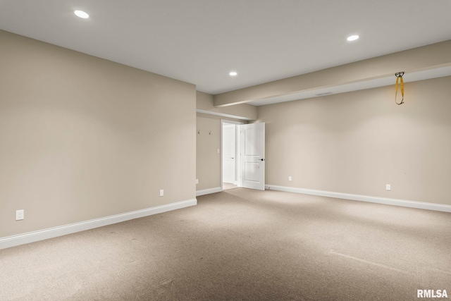 carpeted empty room featuring baseboards and recessed lighting