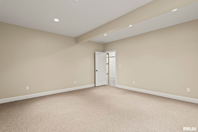 unfurnished room featuring baseboards, light colored carpet, recessed lighting, and beam ceiling
