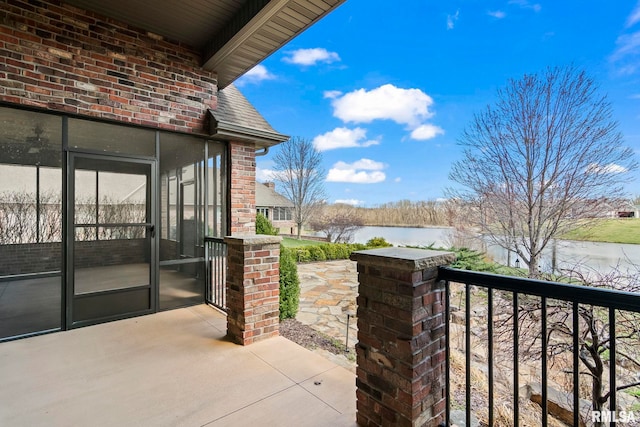 view of patio featuring a water view