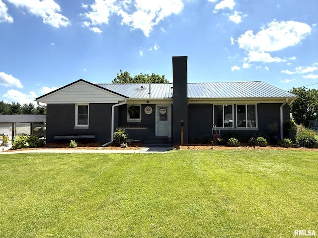 308 Galesburg Rd, Knoxville, IL 61448 - single story home with a chimney, a front lawn, and a metal roof