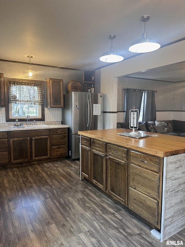308 Galesburg Rd, Knoxville, IL 61448 - kitchen featuring wooden counters, freestanding refrigerator, dark wood-style flooring, and hanging light fixtures