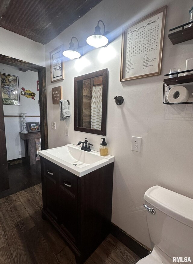 308 Galesburg Rd, Knoxville, IL 61448 - bathroom featuring vanity and wood finished floors