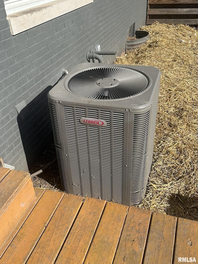 308 Galesburg Rd, Knoxville, IL 61448 - exterior view of a central air condition unit and brick siding
