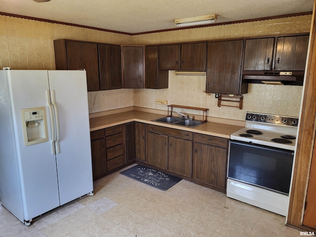 9625 Rock Quarry Rd, Quincy, IL 62305 - kitchen with under cabinet range hood, white appliances, a sink, and dark brown cabinets