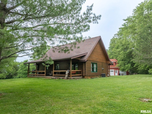 602 SE 13th St, Aledo, IL 61231 - back of property featuring log exterior, a yard, a shingled roof, and an attached garage