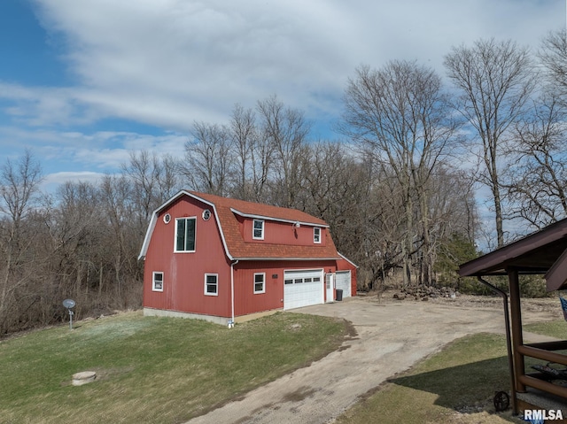 view of property exterior featuring dirt driveway, a shingled roof, a gambrel roof, and a yard