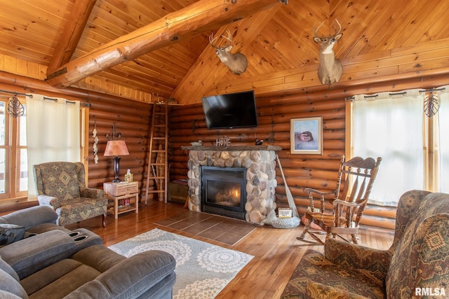 living area featuring vaulted ceiling with beams, rustic walls, and wood-type flooring