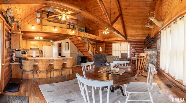 602 SE 13th St, Aledo, IL 61231 - dining room featuring ceiling fan, light wood finished floors, rustic walls, a wooden ceiling with exposed beams, and stairs