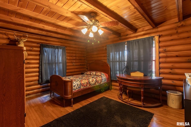 602 SE 13th St, Aledo, IL 61231 - bedroom featuring a wooden ceiling with exposed beams, hardwood / wood-style floors, and rustic walls