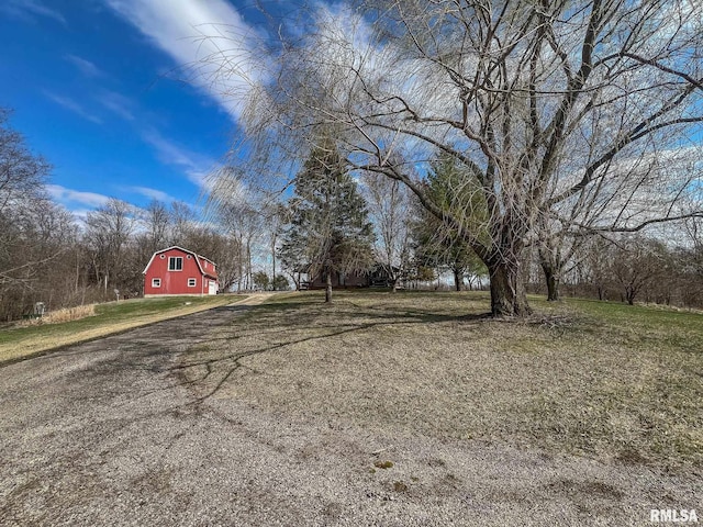 view of yard with an outbuilding and a barn