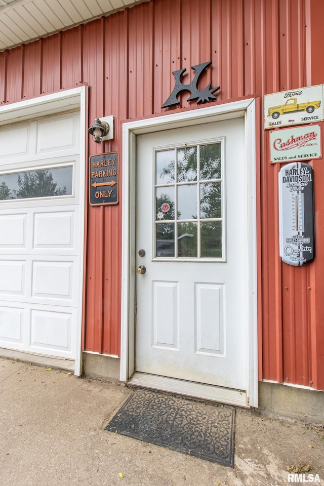 602 SE 13th St, Aledo, IL 61231 - view of exterior entry featuring board and batten siding