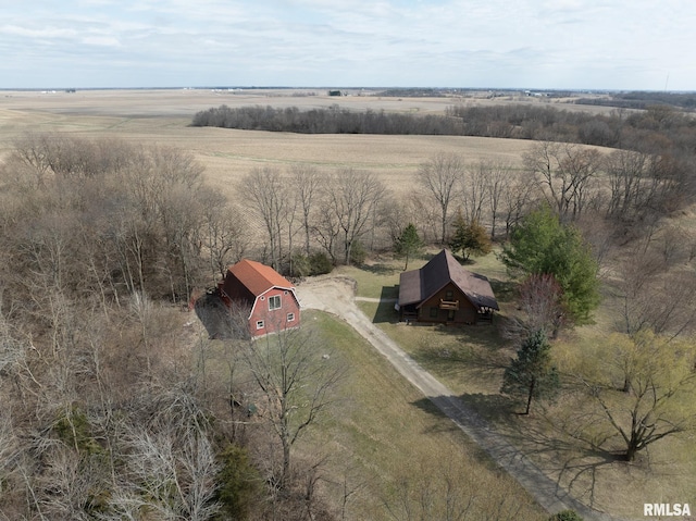 birds eye view of property with a rural view