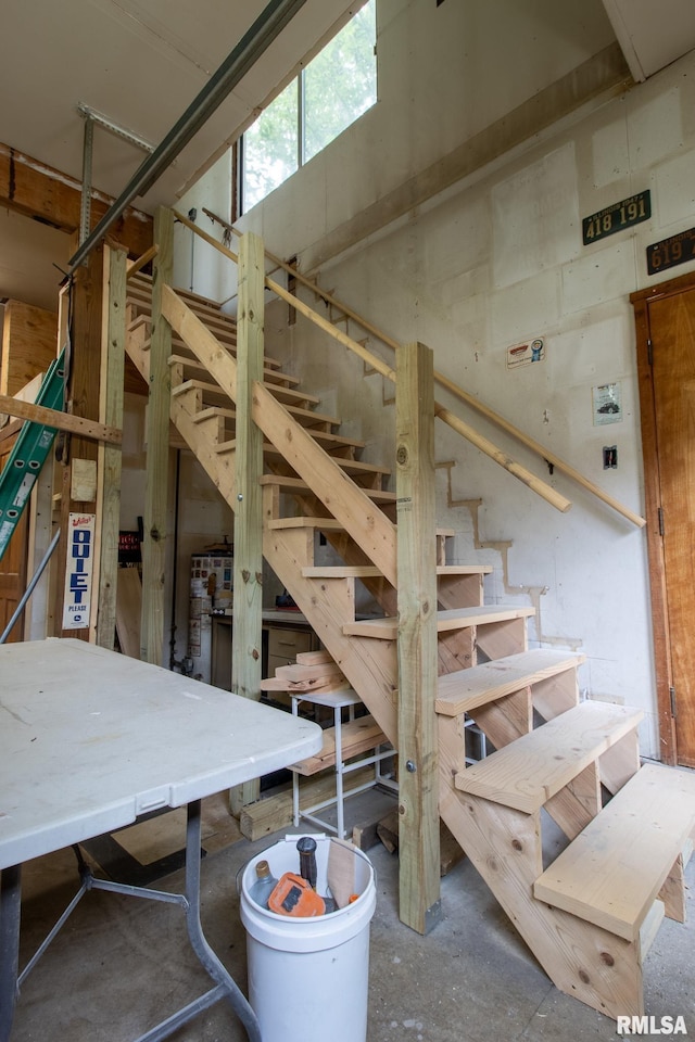 602 SE 13th St, Aledo, IL 61231 - stairway featuring unfinished concrete floors