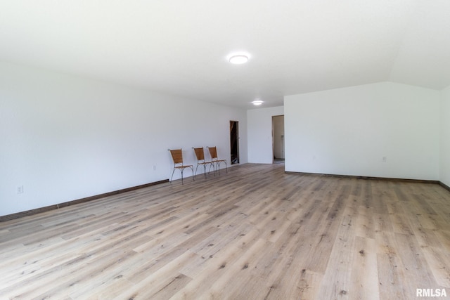 602 SE 13th St, Aledo, IL 61231 - unfurnished room with light wood finished floors and vaulted ceiling