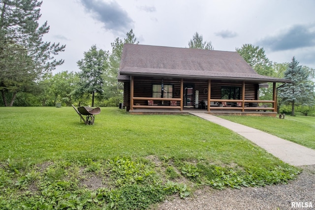 602 SE 13th St, Aledo, IL 61231 - view of front of home with log siding, a front yard, and a porch