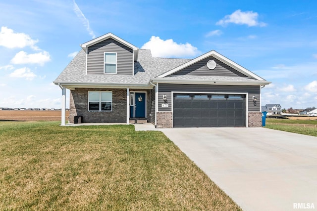 413 Hodges Ct, Chatham, IL 62629 - view of front of property with brick siding, a front yard, driveway, and a garage