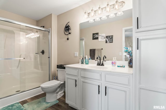 413 Hodges Ct, Chatham, IL 62629 - full bathroom with a shower stall, wood finished floors, toilet, and vanity