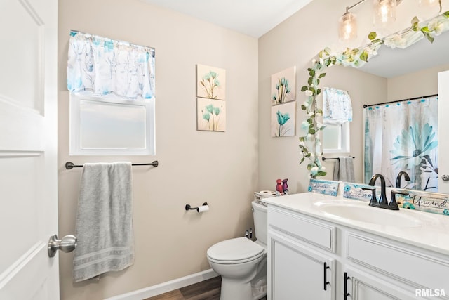 413 Hodges Ct, Chatham, IL 62629 - full bathroom featuring a shower with curtain, vanity, toilet, baseboards, and wood finished floors