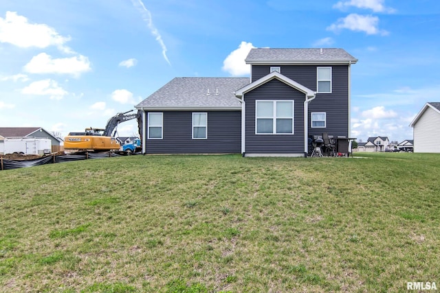 413 Hodges Ct, Chatham, IL 62629 - back of house featuring a shingled roof and a lawn