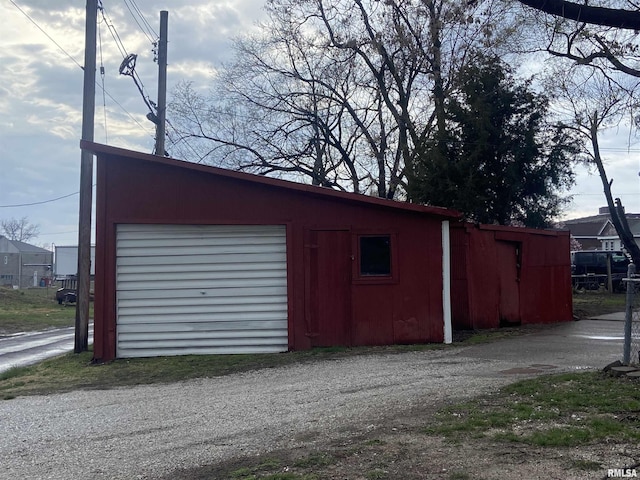 garage featuring driveway