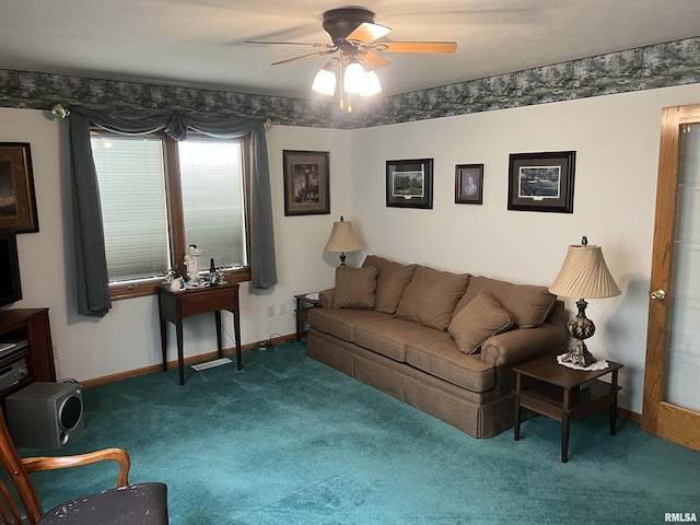 living area with carpet flooring, a ceiling fan, and baseboards