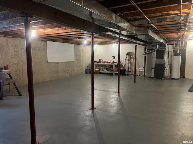 unfinished below grade area with heating unit and gas water heater