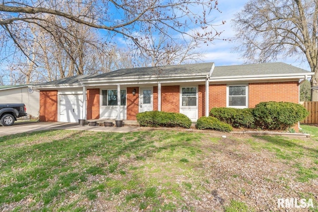 single story home featuring a front yard, an attached garage, fence, concrete driveway, and brick siding