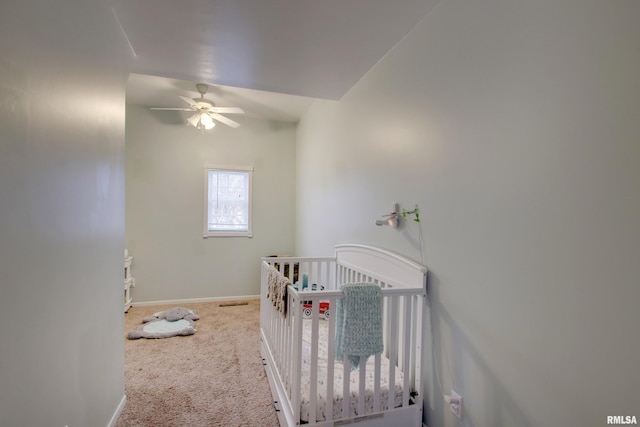 214 N Ohio St, Camp Point, IL 62320 - bedroom featuring carpet, a nursery area, ceiling fan, and baseboards