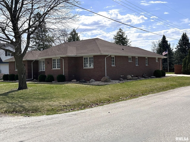 290 W Railroad St, Roseville, IL 61473 - single story home featuring brick siding, a shingled roof, and a front lawn