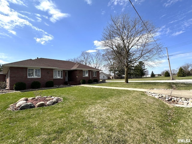 290 W Railroad St, Roseville, IL 61473 - single story home featuring brick siding, a shingled roof, and a front lawn