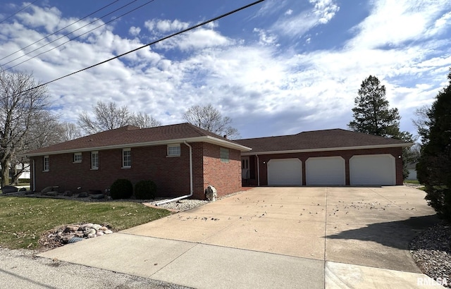 290 W Railroad St, Roseville, IL 61473 - view of front facade with brick siding, driveway, and an attached garage