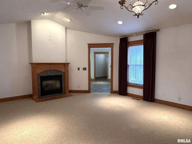 290 W Railroad St, Roseville, IL 61473 - unfurnished living room with carpet floors, lofted ceiling, a premium fireplace, and ceiling fan with notable chandelier