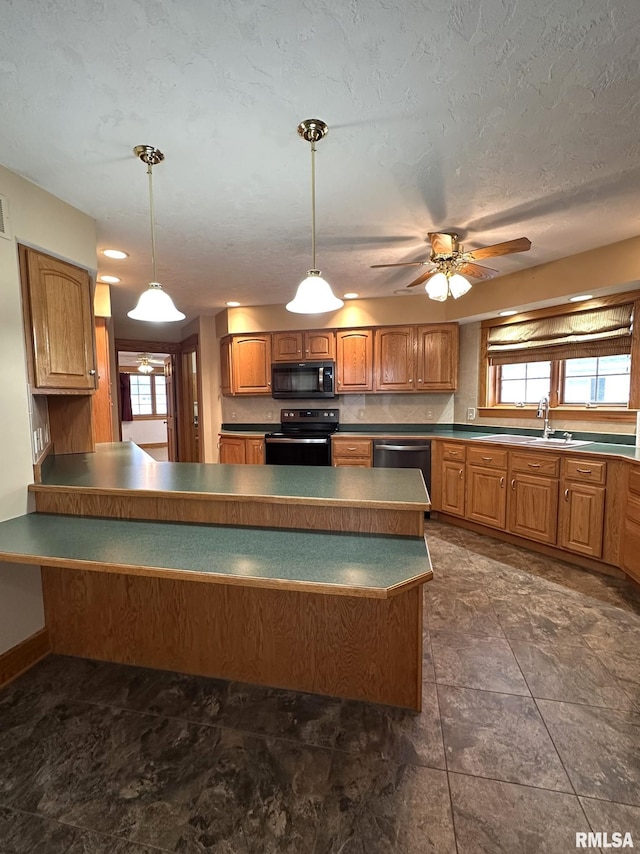 290 W Railroad St, Roseville, IL 61473 - kitchen with dark countertops, black range with electric cooktop, pendant lighting, and stainless steel dishwasher