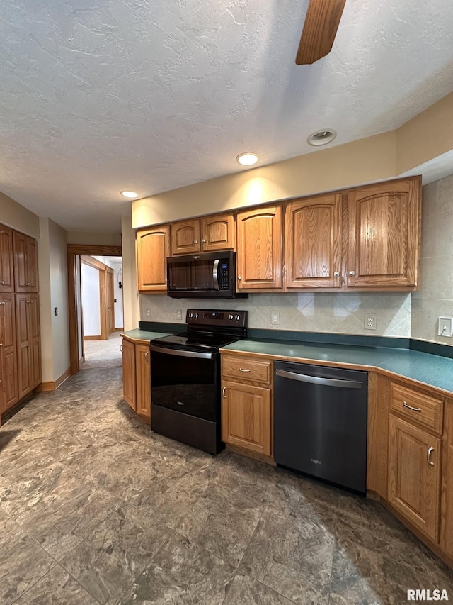 290 W Railroad St, Roseville, IL 61473 - kitchen with baseboards, a textured ceiling, dark countertops, black appliances, and brown cabinets