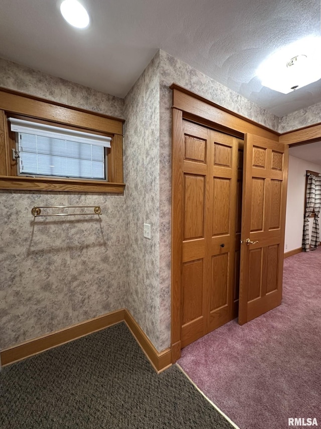 290 W Railroad St, Roseville, IL 61473 - hallway featuring baseboards, wallpapered walls, carpet floors, and a textured ceiling