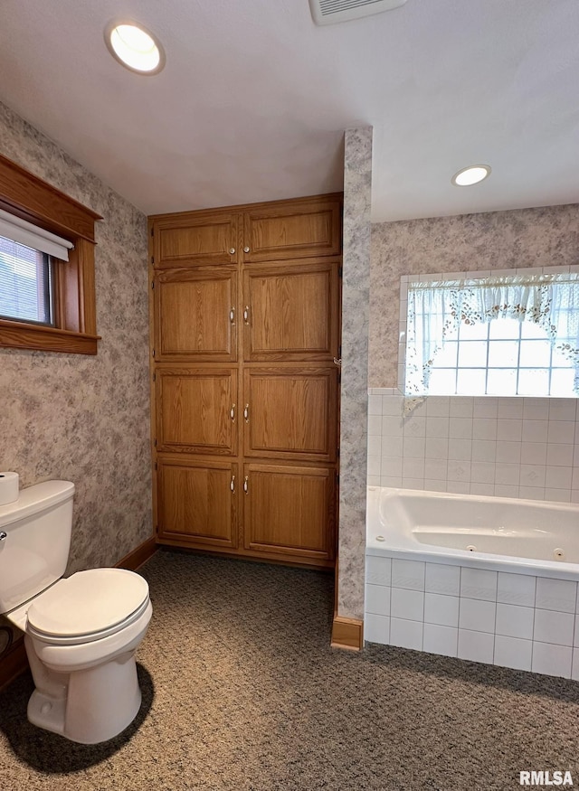 290 W Railroad St, Roseville, IL 61473 - bathroom with wallpapered walls, toilet, a jetted tub, visible vents, and recessed lighting