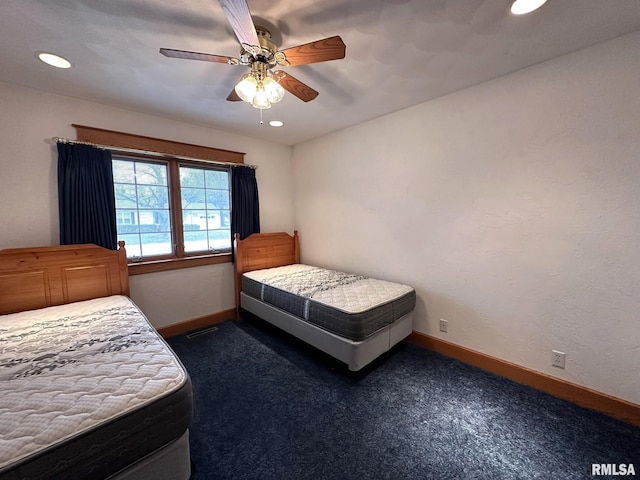 290 W Railroad St, Roseville, IL 61473 - bedroom with baseboards, dark colored carpet, recessed lighting, and a ceiling fan