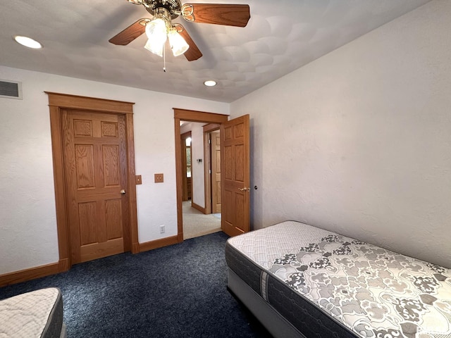 290 W Railroad St, Roseville, IL 61473 - bedroom with baseboards, visible vents, ceiling fan, and dark carpet