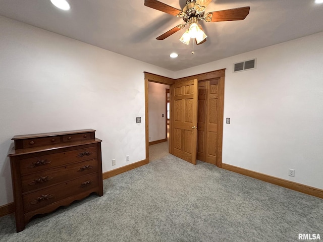 290 W Railroad St, Roseville, IL 61473 - unfurnished bedroom with baseboards, visible vents, and light colored carpet