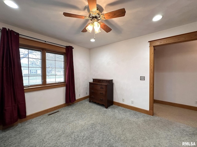 290 W Railroad St, Roseville, IL 61473 - unfurnished bedroom with baseboards, visible vents, ceiling fan, and carpet floors
