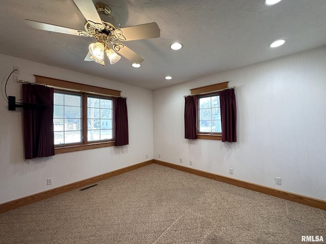 290 W Railroad St, Roseville, IL 61473 - carpeted spare room with baseboards, ceiling fan, visible vents, and recessed lighting