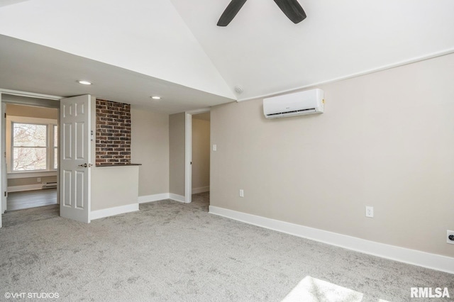 418 4th St, Illiopolis, IL 62539 - unfurnished living room with lofted ceiling, carpet flooring, an AC wall unit, baseboards, and ceiling fan