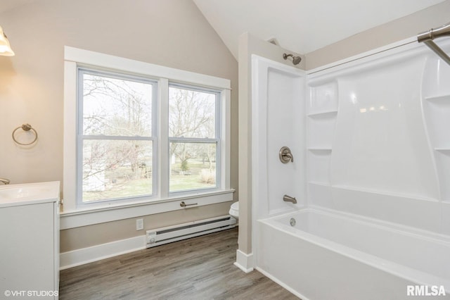 418 4th St, Illiopolis, IL 62539 - bathroom featuring toilet, vanity,  shower combination, wood finished floors, and baseboard heating