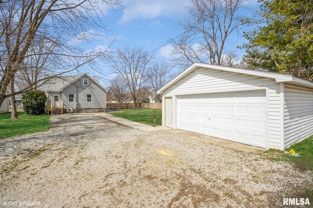 418 4th St, Illiopolis, IL 62539 - detached garage featuring driveway and fence