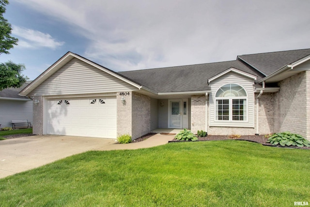 4804 Elm St, Quincy, IL 62305 - ranch-style home featuring an attached garage, brick siding, concrete driveway, roof with shingles, and a front lawn